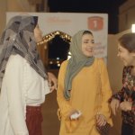 A group of young Muslim girls talking and laughing amongst themselves